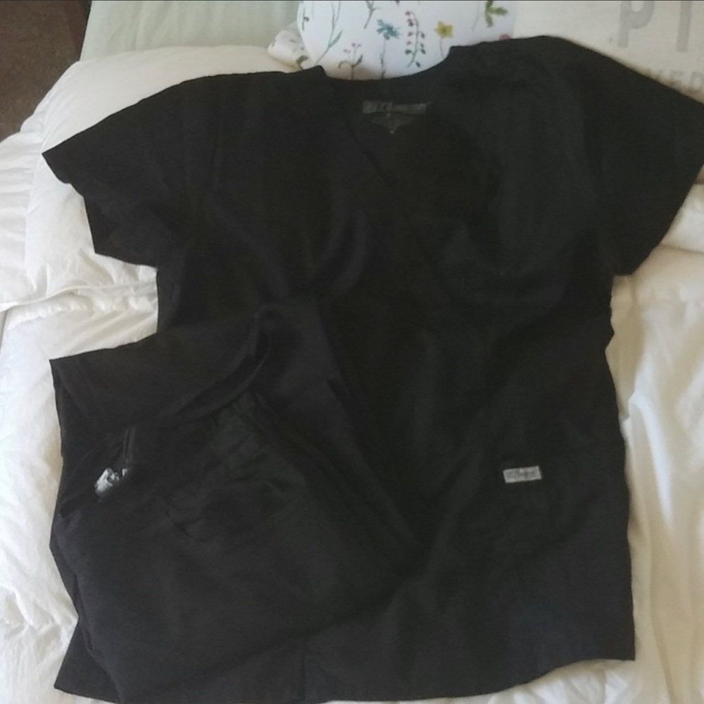 2 sets of grey’s anatomy scrubs.  Size medium slightly flair leg fit